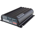 REDARC BCDC1225D 25A DC-DC battery charger showing black housing, mounting feet and charge-status indicators.